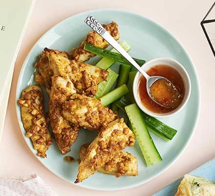 Photo dish of nutty chicken satay strips.